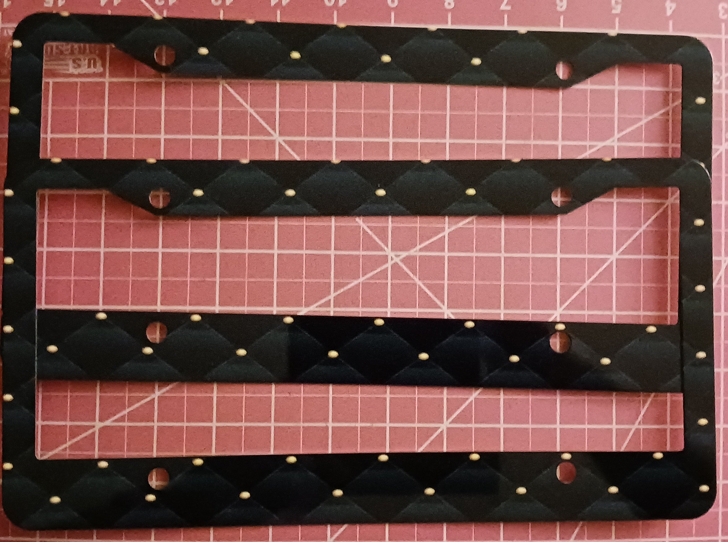 Black with diamond pattern license plate frame